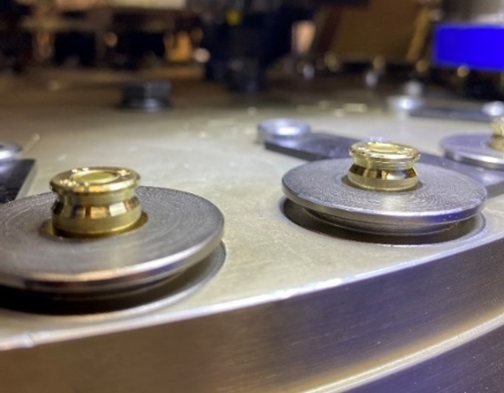 Primers on the rotary turret of the primer inserting machine